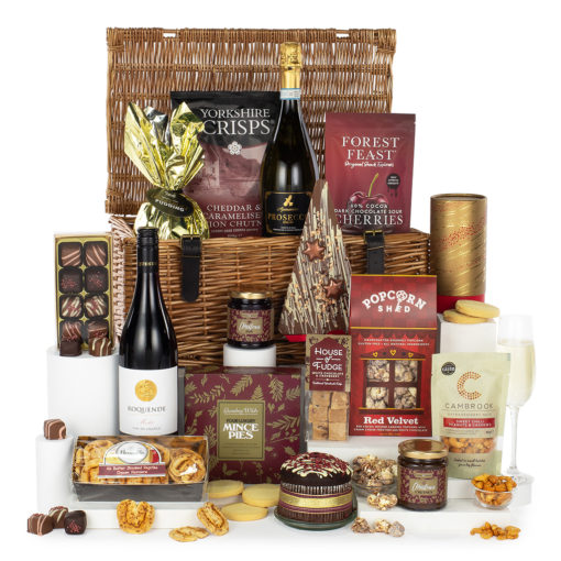 a gift basket with a variety of snacks and treats in a lidded wicker basket