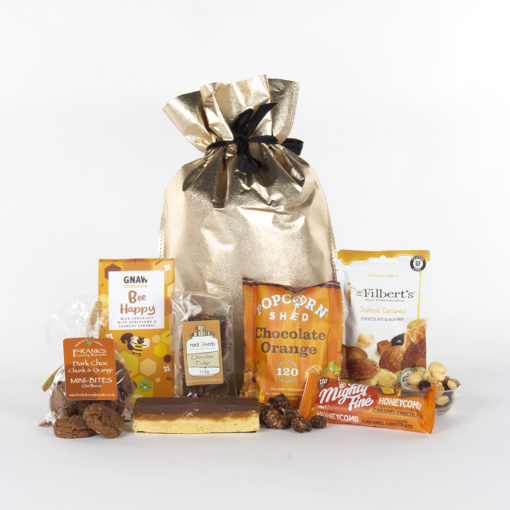 a variety of chocolate treats and a gold gift bag