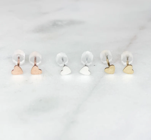 three pairs of heart stud earrings - one silver, one gold, one rose gold