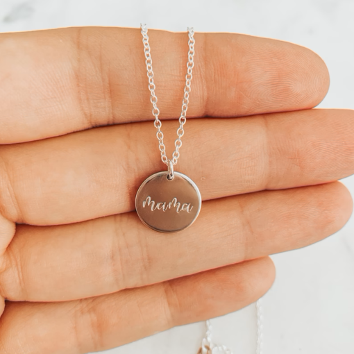 silver necklace with circle pendant that reads mama