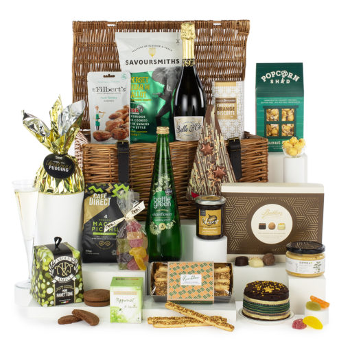 a large gift basket with a variety of treats, snacks, and bubbly drinks, presented in a lidded wicker basekt